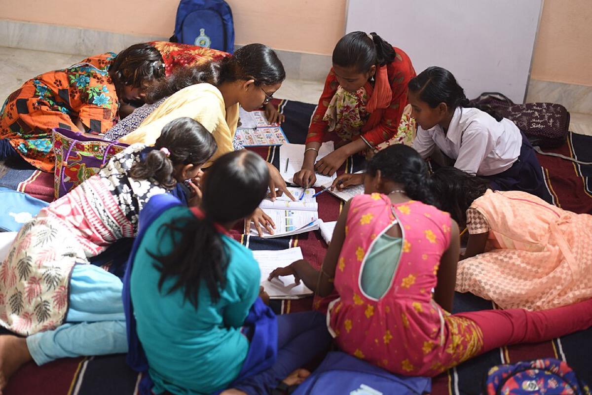 A peer study group of Indian students working through practice questions together